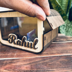 Top view of wooden piggy bank with cash counter